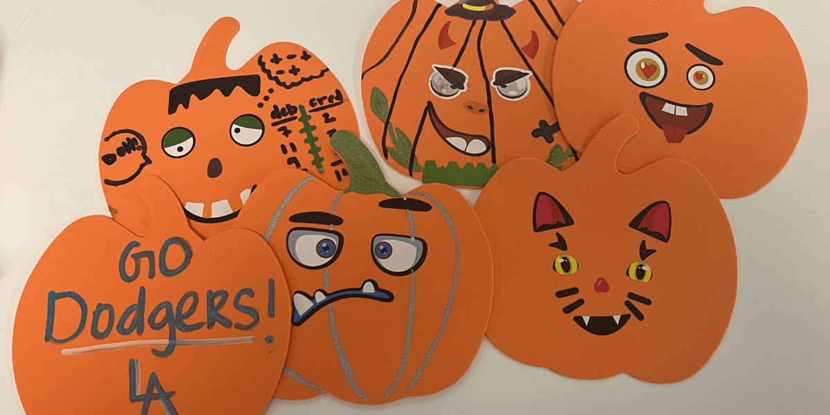 six decorated paper pumpkins